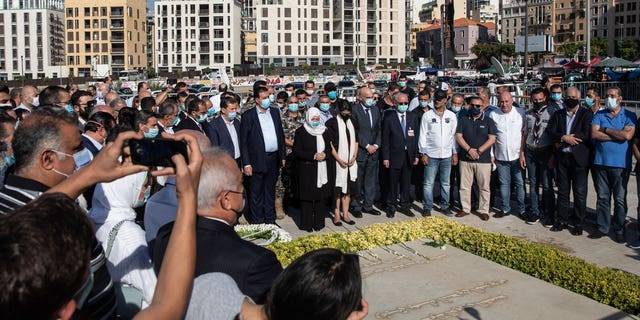 Bahiya al-Hariri, the sister of Lebanon's former Prime Minister Rafik al-Hariri, prays at his grave on Aug. 18, 2020 in Beirut, Lebanon.