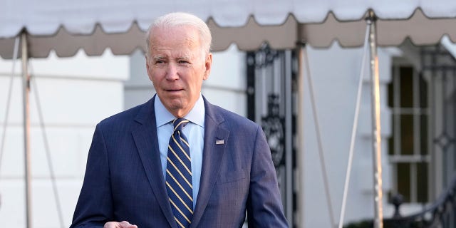 President Joe Biden walks over to talk with reporters before he and first lady Jill Biden board Marine One on the South Lawn of the White House in Washington, Wednesday, Jan. 11, 2023.