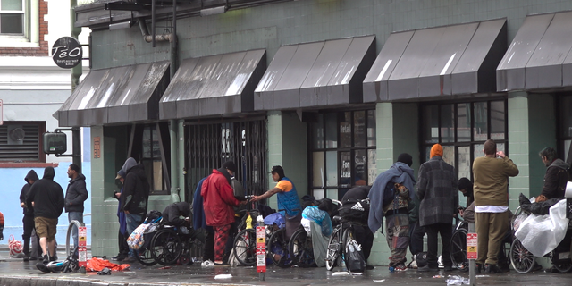 Drug users and dealers gather across the street from the San Francisco Federal Building.