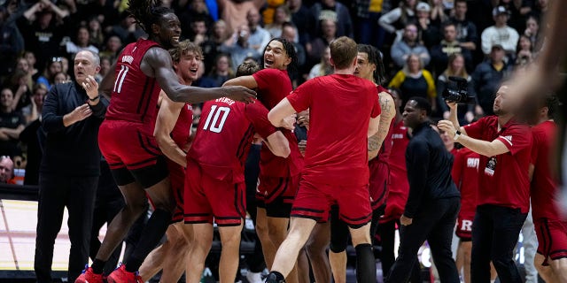 Rutgers players celebrate after defeating Purdue 65-64 in an NCAA college basketball game in West Lafayette, Indiana, on Monday, January 2, 2023.