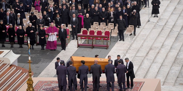 The coffin of late Pope Emeritus Benedict XVI is brought to St. Peter's Square for a funeral mass at the Vatican, Thursday, Jan. 5, 2023