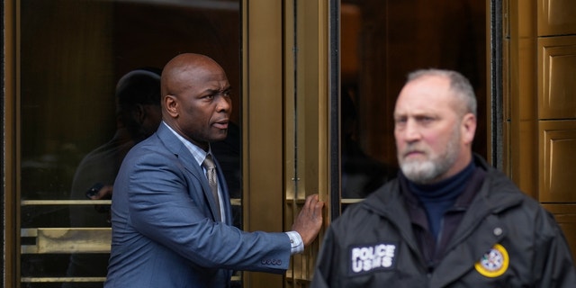 Jennifer Shah's husband Sharrieff Shah, left, leaves federal court in New York on Friday.