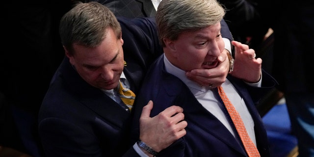 Rep. Richard Hudson, RN.C., left, pulling Rep. Mike Rogers, R-Ala., back as they talk with Rep. Matt Gaetz, R-Fla., and other during the 14th round of voting for speaker as the House met for the fourth day to try and elect a speaker and convene the 118th Congress in Washington, Friday, Jan. 6, 2023. 