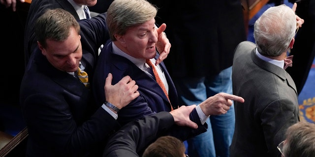 Rep. Richard Hudson, R-N.C., intervenes to stop Rep. Mike Rogers, R-Ala., in the U.S. Capitol Building, in Washington D.C., Friday, Jan. 6, 2023. 