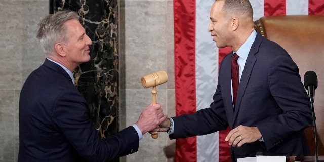 Incoming House Speaker Kevin McCarthy of Calif., receives the gavel from House Minority Leader Hakeem Jeffries of N.Y., on the House floor at the U.S. Capitol in Washington, early Saturday, Jan. 7, 2023. 