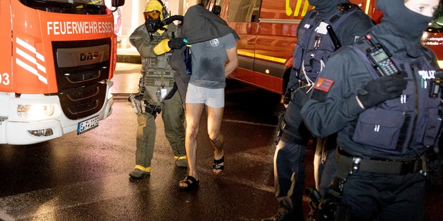 A man is taken into custody by the Special Operations Command in Castrop-Rauxel, Sunday 1 January.  8, 2023. 