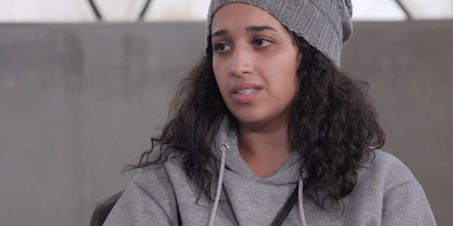 In this still from video, Hoda Muthana speaks during an interview at Syria's Roj detention camp, where she is being held by US-allied Kurdish forces.