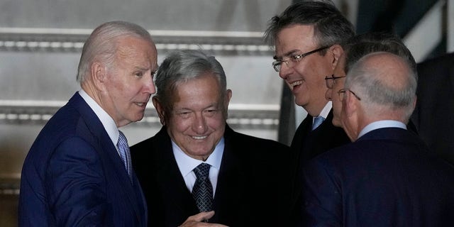 President Biden is greeted at his arrival by Mexican President Andres Manuel Lopez Obrador, second left, Mexican Foreign Minister Marcelo Ebrard, second right, and U.S. Ambassador to Mexico Ken Salazar, right, at the Felipe Angeles international airport in Zumpango, Mexico, Sunday, Jan. 8, 2023. 
