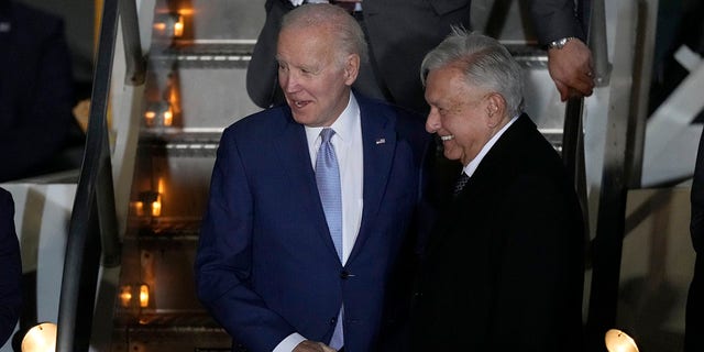 President Biden is greeted by Mexican President Andres Manuel Lopez Obrador during his arrival at the Felipe Angeles international airport in Zumpango, Mexico, Sunday, Jan. 8, 2023. 