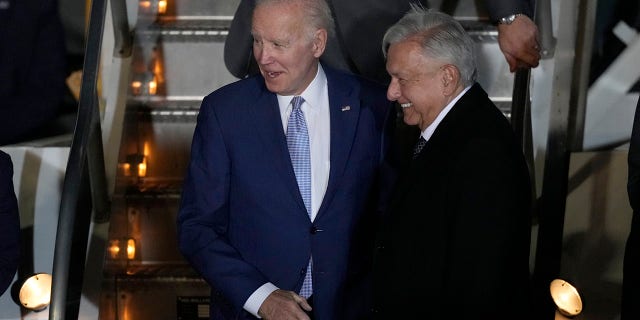 President Biden is greeted by Mexican President Andres Manuel Lopez Obrador during his arrival at the Felipe Angeles international airport in Zumpango, Mexico, Sunday, Jan. 8, 2023.