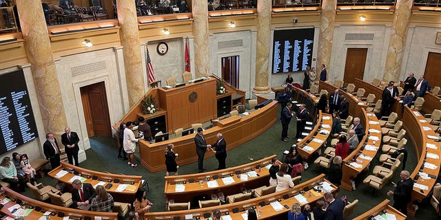 Arkansas lawmakers gather in the House of Representatives chamber at the state Capitol in Little Rock, Ark. on Monday, Jan. 9, 2023. 