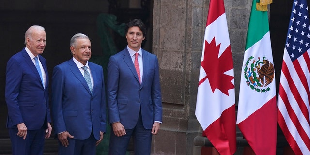 U.S. President Joe Biden, left, Mexican President Andrés Manuel López Obrador, second from left, and Canada's Prime Minister Justin Trudeau pose for an official photo as their wives stand to the side, before the start of a North America Summit at the National Palace in Mexico City, Tuesday, Jan. 10, 2023. 