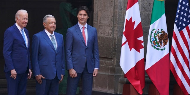 US President Joe Biden, left, Mexican President Andrés Manuel López Obrador, second from left, and Canada's Prime Minister Justin Trudeau pose for an official photo as their wives stand to the side, before the start of a North America Summit at the National Palace in Mexico City, Tuesday, Jan. 10, 2023. 