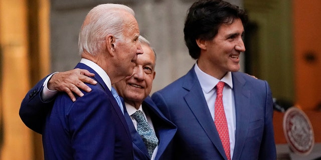 President Joe Biden, Mexican President Andres Manuel Lopez Obrador and Canadian Prime Minister Justin Trudeau embrace during a press conference during the 10th North American Leaders Summit at the National Palace in Mexico City, Tuesday, January 10, 2023. 