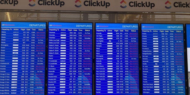 A message board shows departures at Ronald Reagan Washington National Airport in Arlington, Virginia, on Wednesday. A computer outage at the Federal Aviation Administration brought flights to a standstill across the U.S. on Wednesday.