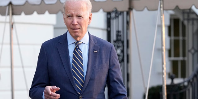 President Joe Biden walks over to talk with reporters before he and first lady Jill Biden board Marine One on the South Lawn of the White House, Wednesday, Jan. 11, 2023.