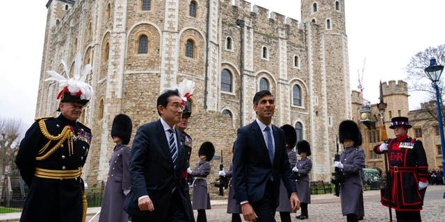 Prime Ministers Rishi Sunak and Fumio Kishida arrive at the Tower of London, Wednesday, Jan. 11, 2023.
