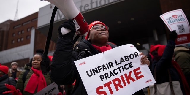 Protestors march on the streets around Montefiore Medical Center during a nursing strike, Wednesday, Jan. 11, 2023, in the Bronx borough of New York. 