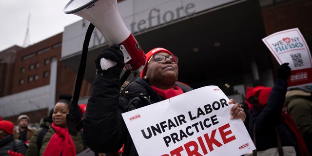 Protestors march on the streets around Montefiore Medical Center during a nursing strike, Wednesday, Jan. 11, 2023, in the Bronx borough of New York. 