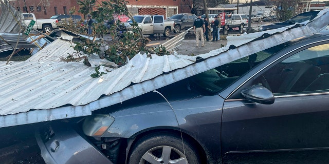 A damaged vehicle and debris are seen after a storm on Thursday, January 12, 2023 in Selma, Alabama. 