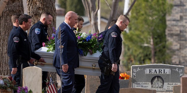 Pallbearers carry caskets to a graveside service for the Haight and Earl families in La Verkin, Utah, Friday, Jan. 13, 2023, in La Verkin, Utah.  Tausha Haight, her mother, Gail Earle, and her five children were shot and killed by her husband on January 4th. 