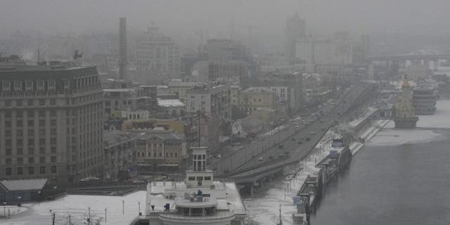 Fog covers Kyiv city center, Ukraine, Saturday, Jan. 14, 2023. A series of explosions rocked Kyiv on Saturday morning and minutes later air raid sirens started to wail as an apparent missile attack on the Ukrainian capital was underway. 