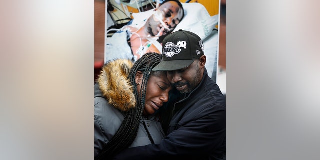 Kenyana Dixon is comforted during a rally for her brother Tyre Nichols at the National Civil Rights Museum on Monday, Jan. 16, 2023. 