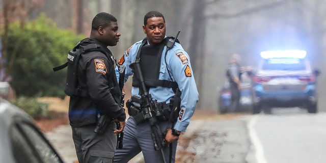 Georgia state troopers stand along Key Road in Atlanta on Wednesday, Jan. 18, 2023.
