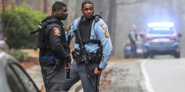 Georgia state troopers stand along Key Road in Atlanta on Wednesday, Jan. 18, 2023.