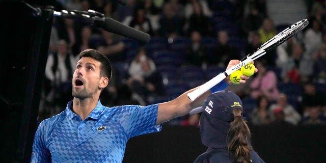 Novak Djokovic of Serbia argues with the chair umpire during his second round match against Enzo Couacaud of France at the Australian Open tennis championship in Melbourne, Australia, Thursday, Jan. 19, 2023.