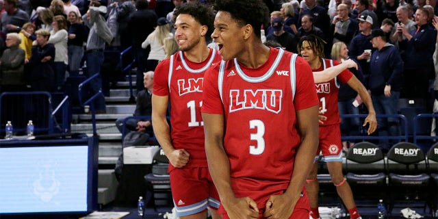 Loyola Marymount guards Chance Stephens, right, and Kwane Marble celebrate the team's 68-67 win against Gonzaga, Thursday, Jan. 19, 2023, in Spokane, Washington.