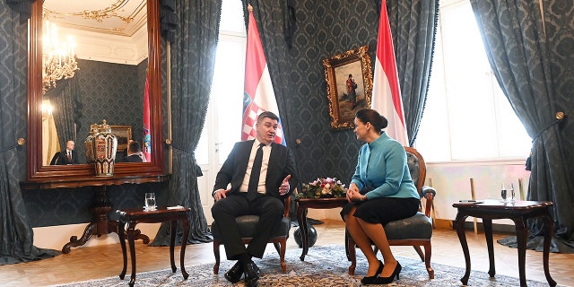 Hungarian President Katalin Novak, right, and Croatian President Zoran Milanovic hold a bilateral meeting in the presidential Alexander Palace in Budapest, Hungary, Friday, Jan. 20, 2023.