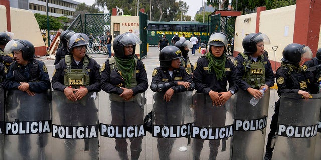 Police guard the University of San Marcos in Lima, Peru, on Saturday, January 21, 2023. 