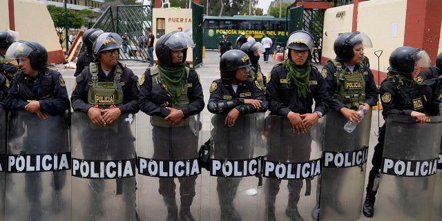 Police guard the San Marcos University in Lima, Peru, Saturday, Jan. 21, 2023.