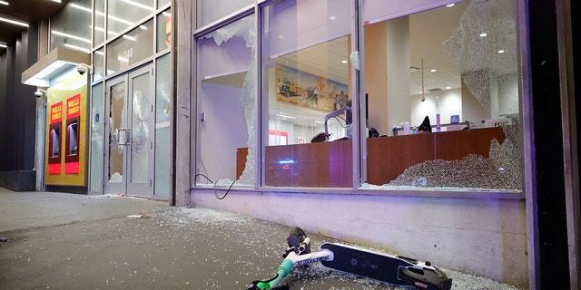 Broken windows at a Wells Fargo branch are seen following a violent protest, late Saturday, Jan. 21, 2023, in Atlanta.