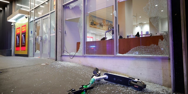 Broken windows at a Wells Fargo branch are seen following a violent protest, late Saturday, Jan. 21, 2023, in Atlanta.