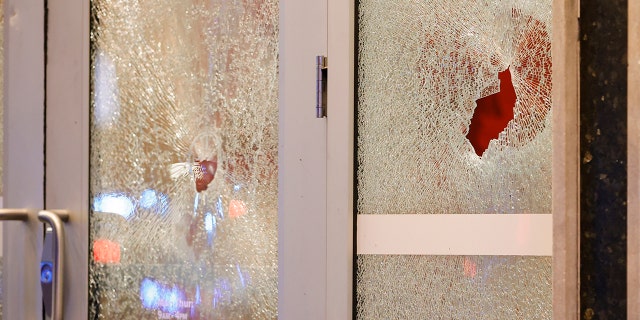 Broken windows at a Wells Fargo branch are seen following a protest, Saturday, Jan. 21, 2023, in Atlanta, in the wake of the death of an environmental activist killed after authorities said the 26-year-old shot a state trooper. 