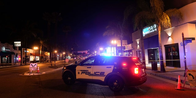 A police car is seen near the scene of the shooting in Monterey Park, California on Sunday, January 22, 2023. 