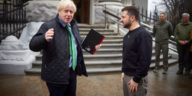 In this photo provided by the Ukrainian Presidential Press Office, Ukrainian President Volodymyr Zelenskyy, right, and former British Prime Minister Boris Johnson talk during their meeting in Kyiv, Ukraine, Sunday, Jan. 22, 2023. 