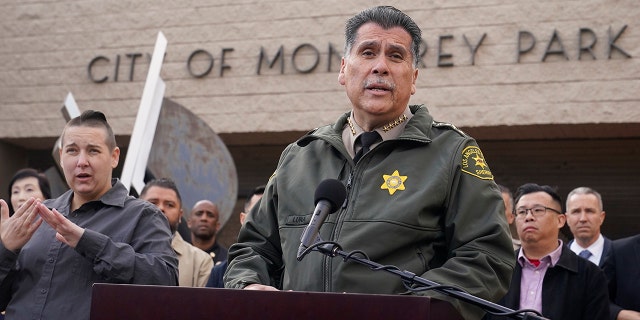 Los Angeles County Sheriff Robert Luna, at podium, briefs the media outside the Civic Center in Monterey Park, Calif., Sunday, Jan. 22, 2023. 