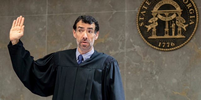 Fulton County Superior Court Judge Robert McBurney swears in potential jurors during proceedings to seat a special purpose grand jury in Atlanta, on May 2, 2022. 