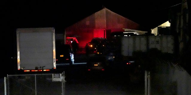 Law enforcement personnel control the scene of a shooting, Monday, Jan. 23, 2023, in Half Moon Bay, California.