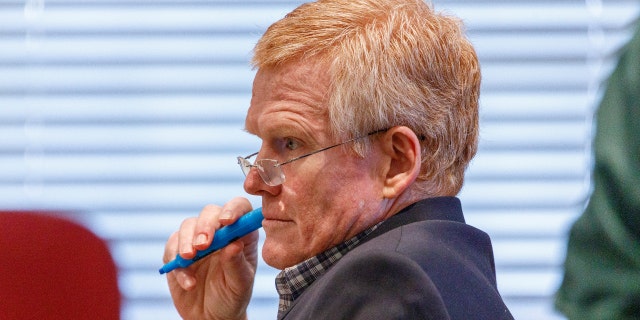 Alex Murdaugh waits during a break in the jury selection process on the second day of jury selection at his trial at the Colleton County Courthouse in Walterboro, S.C., Tuesday, Jan. 24, 2023.