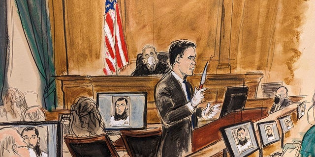 In this courtroom sketch, Assistant U.S. Attorney Jason Richmond gives the government summations in Manhattan federal court on Tuesday, Jan. 24, 2023, in New York, holding up a knife that defendant Sayfullo Saipov allegedly possessed during his attack.