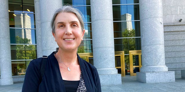 Colorado lawyer Autumn Scardina poses for photos outside the Ralph Carr Colorado Judicial Center in Denver. Scardina, who is transgender, sued Colorado baker Jack Phillips after he refused to make her a cake intended to celebrate her gender transition. 