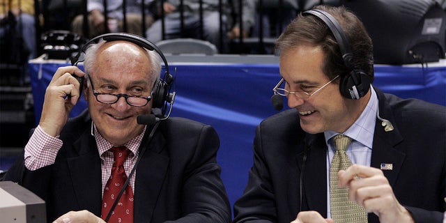 CBS announcers Billy Packer, left, and Jim Nantz laugh during a break in the championship game of the Big Ten basketball tournament in Indianapolis March 12, 2006. Packer, an Emmy award-winning college basketball broadcaster who covered 34 Final Fours for NBC and CBS, died Thursday night, Jan. 26, 2023. He was 82. Packer's son, Mark, told The Associated Press his father had been hospitalized in Charlotte, N.C., for the past three weeks and had several medical issues and ultimately succumbed to kidney failure.
