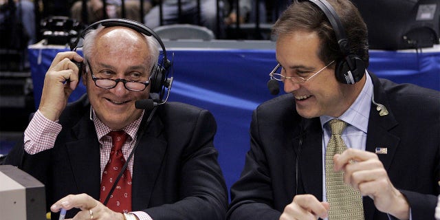 CBS announcers Billy Packer, left, and Jim Nantz laugh during a break at the Big Ten basketball tournament championship game in Indianapolis March 12, 2006. Packer, an Emmy Award-winning college basketball announcer who covered 34 Final Fours for NBC and CBS, died on Thursday night, January 26, 2023. He was 82 years old.  Packer's son, Mark, told The Associated Press that his father had been hospitalized in Charlotte, North Carolina, for the past three weeks and had various medical problems, eventually succumbing to kidney failure.  .