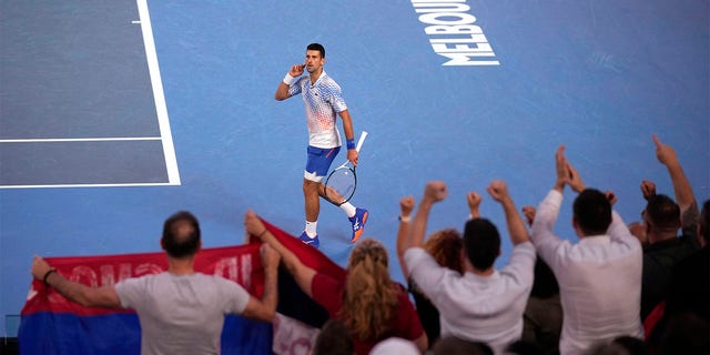Novak Djokovic of Serbia reacts after winning the first set against Tommy Paul of the U.S. during their semifinal at the Australian Open tennis championship in Melbourne, Australia, Friday, Jan. 27, 2023. 