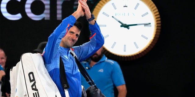 Novak Djokovic of Serbia waves as he leaves Rod Laver Arena after defeating Tommy Paul of the USA in their semi-final match at the Australian Open tennis championships in Melbourne, Australia, Friday, January 27, 2023. 