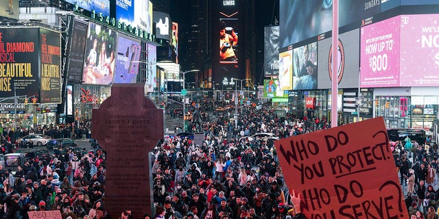 Demonstrators gather during a protest in Times Square on Saturday, Jan. 28, 2023, in New York, in response to the death of Tyre Nichols.